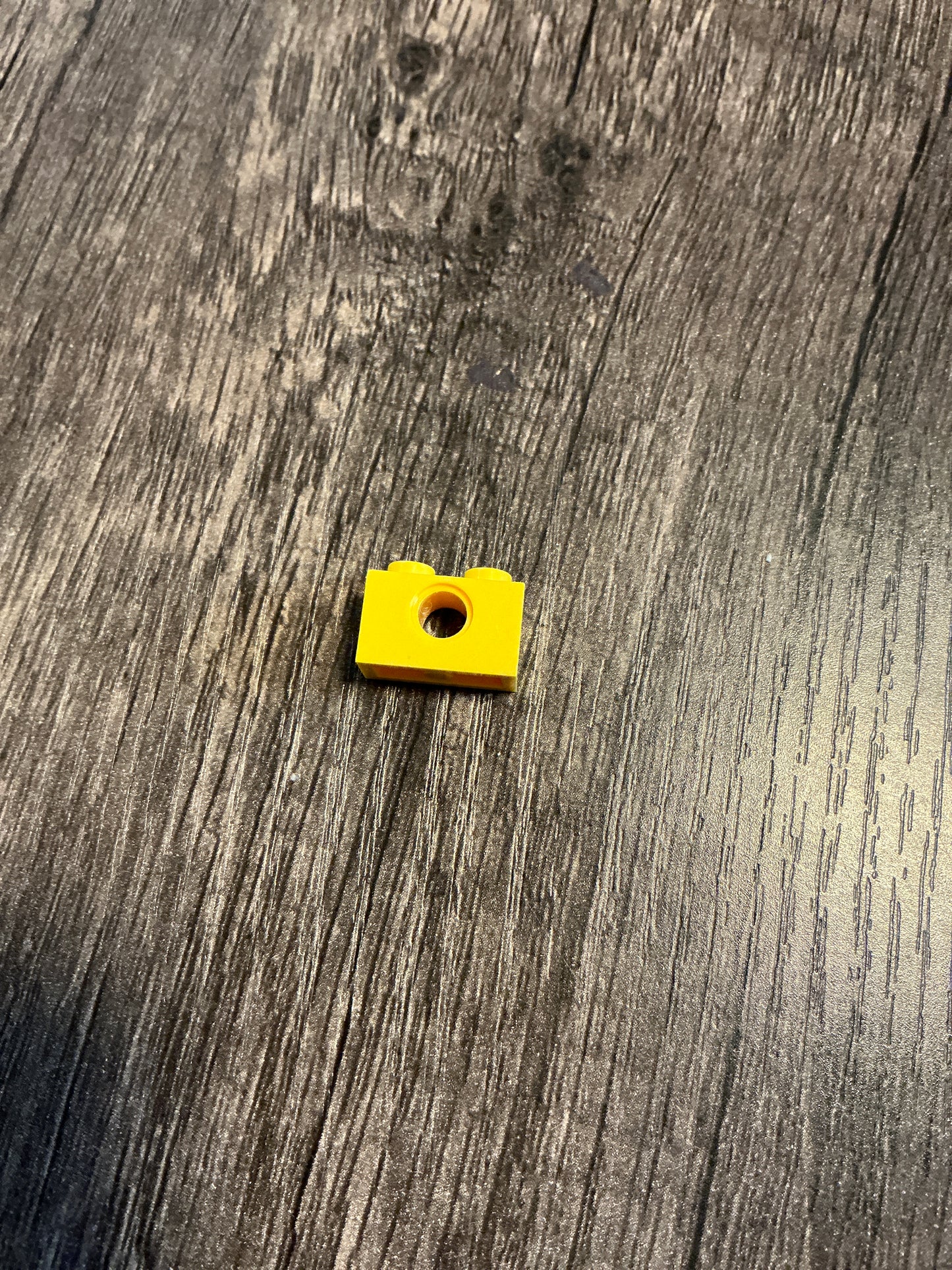 Technic, brick 1 x 2 with Hole yellow