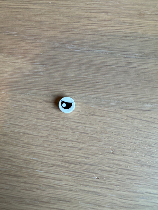 Tile, Round 1 x 1 with Black Eye Partially Closed with Off-Center Pupil Pattern