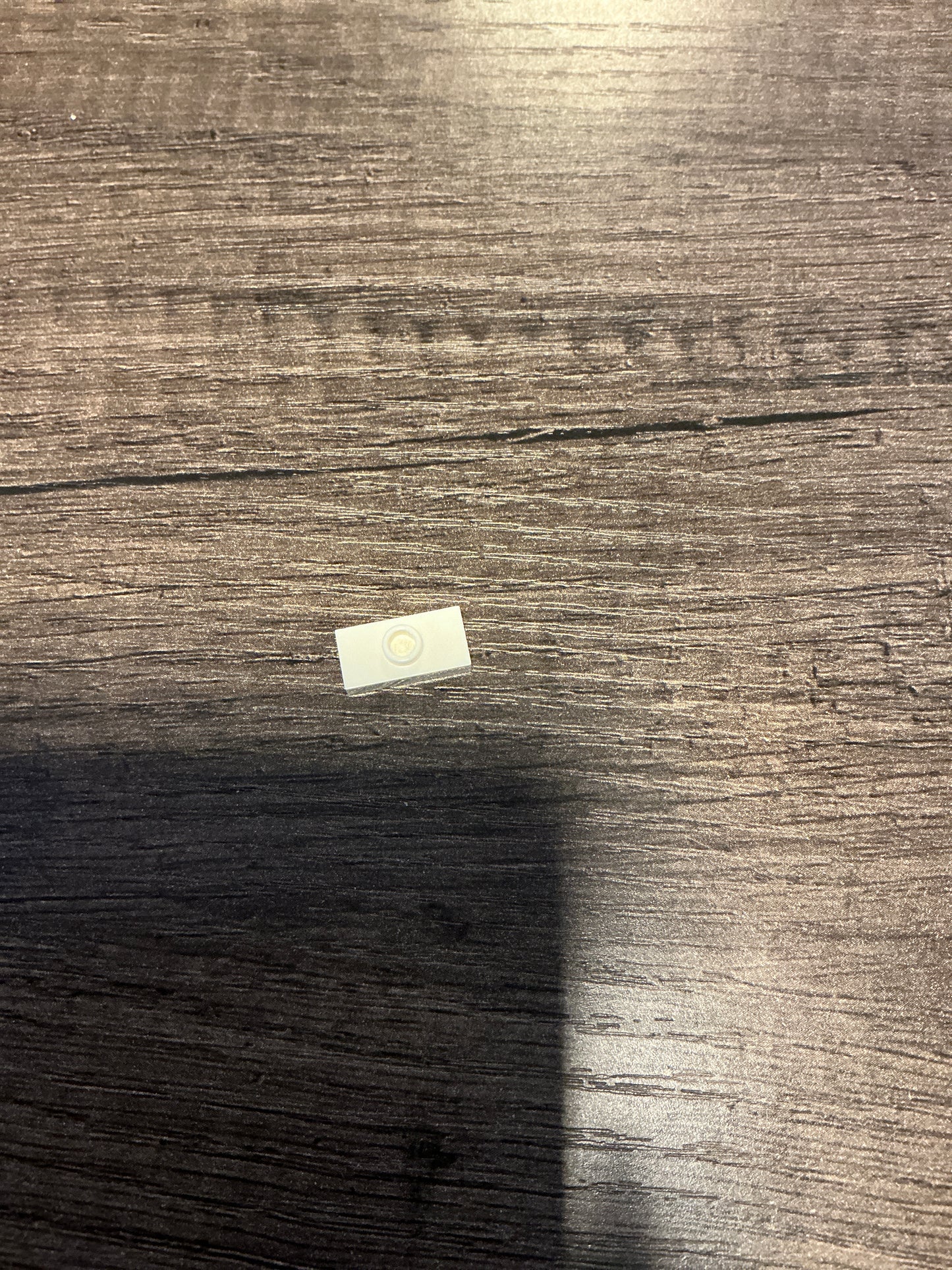 Plate, Modified 1 x 2 with 1 Stud with Groove and Bottom Stud Holder (Jumper) White